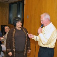 2/23/08 - 26th Annual Crab Feed - Janet Pomeroy Recreation & Rehabilitation Center, San Francisco - Ward Donnelly checks a winner’s ticket before awarding the prize.