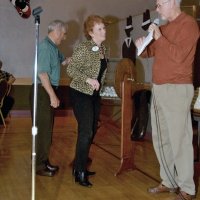 11/29/09 - 31st Annual Guilio Francesconi Charity Raffle drawing, Italian American Social Club, San Francisco - Charlie Bottarini holds the drum while Amy Fink adds her ball; Dick Johnson ready to announce the winners.