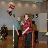 11/29/09 - 31st Annual Guilio Francesconi Charity Raffle drawing, Italian American Social Club, San Francisco - Charlie Bottarini waits while Kathy Salet is just about ready to drop her ball into the drum.