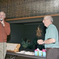 11/29/09 - 31st Annual Guilio Francesconi Charity Raffle drawing, Italian American Social Club, San Francisco - Charlie Bottarini looks on as Dick Johnson explains how the drawing will work.