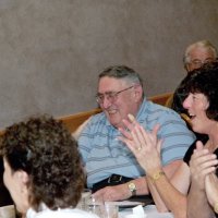 11/29/09 - 31st Annual Guilio Francesconi Charity Raffle drawing, Italian American Social Club, San Francisco - Handford Clews, center, just after learning he and wife Margot have won the grand prize, surrounded by guests.