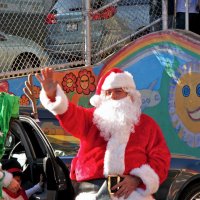 12/18/09 - Christmas with Santa, Mission Education Center, San Francisco - Officer Ignacio “Natcho” Martinez as Santa - Santa waving hello as his helper gets her helper out of the car.