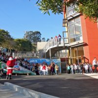 12/18/09 - Christmas with Santa, Mission Education Center, San Francisco - Officer Ignacio “Natcho” Martinez as Santa - More children come out to greet Santa.