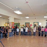 12/18/09 - Christmas with Santa, Mission Education Center, San Francisco - Officer Ignacio “Natcho” Martinez as Santa - A class prepares to sing a song for Santa.