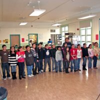 12/18/09 - Christmas with Santa, Mission Education Center, San Francisco - Officer Ignacio “Natcho” Martinez as Santa - A class prepares to sing a song for Santa.