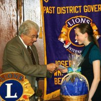 2/18/09 - Granada Cafe, San Francisco - Club Student Speaker Contest - topic “Water - Will California Be Left High and Dry” - L to R: Bob Fenech, Joe Farrah, and Chloe Lessard. Joe Farrah presenting the winner of the contest with her check.