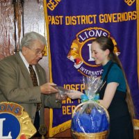 2/18/09 - Granada Cafe, San Francisco - Club Student Speaker Contest - topic “Water - Will California Be Left High and Dry” - Joe Farrah, and Chloe Lessard. Joe Farrah presenting the winner’s plaque to Chloe.