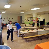 11/20/09 - Thanksgiving Luncheon, Mission Education Center, San Francisco - Staff running around finishing setup before the fun begins.