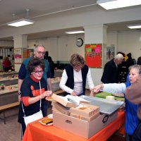 11/20/09 - Thanksgiving Luncheon, Mission Education Center, San Francisco - Pumpkin pies being prepared. L to R: far side: Emily Powell Palmer, Aaron Straus, Diane Johnson, and Al Genilte; near side: Dick Johnson and cafeteria staff.