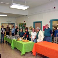 11/20/09 - Thanksgiving Luncheon, Mission Education Center, San Francisco - Wating for the go sign around the table are, L to R: Diane & Dick Johnson, George Salet, Al Gentile, staff, Emily Farrah, Emily Powell Palmer, Bre Jones, Joe Farrah, and Aaron Straus.