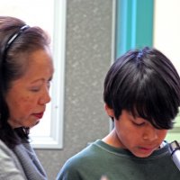 11/20/09 - Thanksgiving Luncheon, Mission Education Center, San Francisco - A student sharing his story from a letter he has written.