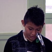 11/20/09 - Thanksgiving Luncheon, Mission Education Center, San Francisco - A student sharing his story from a letter he has written.