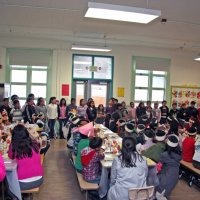 11/20/09 - Thanksgiving Luncheon, Mission Education Center, San Francisco - A class performing their song before lunch.