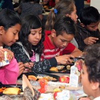 11/20/09 - Thanksgiving Luncheon, Mission Education Center, San Francisco - Students wondering about the food served since it is their first American style Thanksgiving.