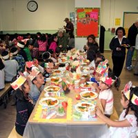 11/20/09 - Thanksgiving Luncheon, Mission Education Center, San Francisco - Students laughing and enjoying.
