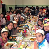 11/20/09 - Thanksgiving Luncheon, Mission Education Center, San Francisco - Students waiting to get started eating their lunch.