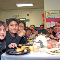 11/20/09 - Thanksgiving Luncheon, Mission Education Center, San Francisco - A class enjoying the lunch.