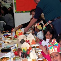 11/20/09 - Thanksgiving Luncheon, Mission Education Center, San Francisco - Aaron Straus serving a teacher after serving the students.