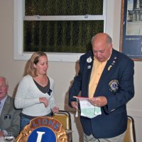 10/20/10 - District Governor Mike Simonini’s Official Visitation - Italian American Social Club, San Francisco - Bre Jones presenting our club banner to District Governor Michael Simonini. L to r: Ward Donnelly (naping), Bre Jones, Michael & Jane Simonini.