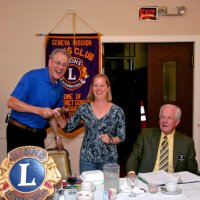 7/21/10 - General Meeting - Italian American Social Club, San Francisco - Outgoing President Lyle Workman “handing off” the gavel to incoming President Bre Jones. On the left edge is Joe Farrah and on the right is Ward Donnelly.