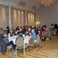 11/28/10 - 32nd Annual Giulio Francesconi Charity Raffle - Upstairs Ballroom, Italian American Social Club, San Francisco - On left: Diane (seated) & Dick Johnson (standing); nearest table: the Bottarini clan with Estelle (purple vest) & Charlie Bottarini; center in very back looking at camera: Leila Roussell; on right in back: Al Gentile (bending over) with Bill Graziano, seated 2nd on his left.