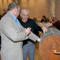 11/28/10 - 32nd Annual Giulio Francesconi Charity Raffle - Upstairs Ballroom, Italian American Social Club, San Francisco - A ticket holder asking Charlie Bottarini if his is a guaranteed winner. Perhaps. Al Gentile just over the ticket holder’s shoulder.