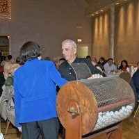 11/28/10 - 32nd Annual Giulio Francesconi Charity Raffle - Upstairs Ballroom, Italian American Social Club, San Francisco - Margot Clews drawing a winner with the help of Charlie Bottarini. As the winners were drawn, the ball was placed in a numbered carton, then, when all had been drawn, they were announced from last prize to Grand Prize.