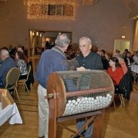 11/28/10 - 32nd Annual Giulio Francesconi Charity Raffle - Upstairs Ballroom, Italian American Social Club, San Francisco - Dutch Blanchard draws a winner as Charlie Bottarini holds the door. Robert Quinn is seated on the left in a blue sweater.