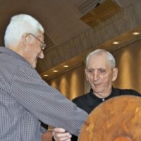 11/28/10 - 32nd Annual Giulio Francesconi Charity Raffle - Upstairs Ballroom, Italian American Social Club, San Francisco - An out-of-focus Al Gentile draws the next winner with Charlie Bottarini.