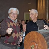 11/28/10 - 32nd Annual Giulio Francesconi Charity Raffle - Upstairs Ballroom, Italian American Social Club, San Francisco - A happy Joe Farrah thinks he may have drawn his own number, later to find out he didn’t win; Charlie Bottarini keeping a close eye.