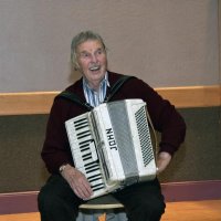 11/28/10 - 32nd Annual Giulio Francesconi Charity Raffle - Upstairs Ballroom, Italian American Social Club, San Francisco - Accordianist John Fiore taking a break while the drawing happens.