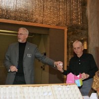 11/28/10 - 32nd Annual Giulio Francesconi Charity Raffle - Upstairs Ballroom, Italian American Social Club, San Francisco - Charlie Bottarini, right, hands Dick Johnson the next winning number.