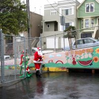 12/17/10 - Annual Christmas with Santa - Mission Education Center, San Francisco - Santa and his helpers just arriving for his visit at the school on a misty Friday morning.