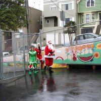 12/17/10 - Annual Christmas with Santa - Mission Education Center, San Francisco - Santa and his helpers just arriving for his visit at the school on a misty Friday morning.