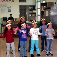 12/17/10 - Annual Christmas with Santa - Mission Education Center, San Francisco - The first grade class singing a song for Santa.