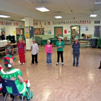 12/17/10 - Annual Christmas with Santa - Mission Education Center, San Francisco - The second grade class performs their song for Santa and his Eleves.