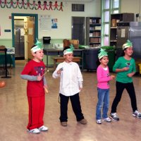 12/17/10 - Annual Christmas with Santa - Mission Education Center, San Francisco - The second grade class performs their song for Santa and his Eleves.