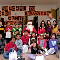 12/17/10 - Annual Christmas with Santa - Mission Education Center, San Francisco - The teacher and third grade students pose with Santa and his Elves.