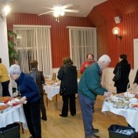 2/20/10 - 27th Annual Crab Feed, Italian American Social Club, San Francisco - Members and guest enjoying hors d’oeuvres. On left in background are Margot Clews (red coat) and Diane Johnson (gold sweater); in forground, looking over the her choices, on left, is Arline Thomas, with Diane Donnelly just over her shoulder; on the right is Al Gentile (greenish jacket).