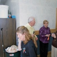 2/20/10 - 27th Annual Crab Feed, Italian American Social Club, San Francisco - Ward Donnelly drawing and announcing winners as a waitress walks by.