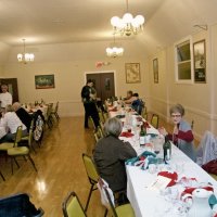 2/20/10 - 27th Annual Crab Feed, Italian American Social Club, San Francisco - Dinner complete, Linda Workman, seated left, with Nancy & Jim Brown-Park talking about something. Behind them is Jackie & Jerry Lowe talking with friends.