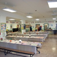 11/19/10 - Annual Thanksgiving Luncheon - Mission Education Center, San Francisco - Tables set and ready to go. In the background, l to r: Aaron Straus, Bre Jones, Arline Thomas, and Al Gentile.