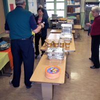 11/19/10 - Annual Thanksgiving Luncheon - Mission Education Center, San Francisco - Starting to prepare the food to be served. On the left, front to back, is Aaron Straus, cafeteria worker, and Al Gentile; on the right is Arline Thomas, and Bre Jones.