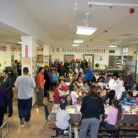 11/19/10 - Annual Thanksgiving Luncheon - Mission Education Center, San Francisco - Chaos as student, teachers, guests, and workers begin to fill the cafeteria. Way in the back can be seen, l to r: Al Gentile, Arline Thomas, Bre Jones, Robert Quinn, and Aaron Straus, along with many others.