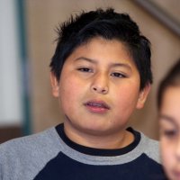 11/19/10 - Annual Thanksgiving Luncheon - Mission Education Center, San Francisco - Student enjoying his first American Thanksgiving.