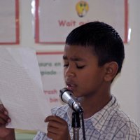 11/19/10 - Annual Thanksgiving Luncheon - Mission Education Center, San Francisco - A student reading his “I’m Thankful” essay.