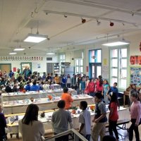 11/19/10 - Annual Thanksgiving Luncheon - Mission Education Center, San Francisco - Students performing a musical number for everyone. In the background left are Al Gentile, Arline Thomas, Bre Jones, Robert Quinn, and Aaron Straus.