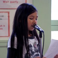 11/19/10 - Annual Thanksgiving Luncheon - Mission Education Center, San Francisco - A student reading her “I’m Thankful” essay.