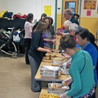 11/19/10 - Annual Thanksgiving Luncheon - Mission Education Center, San Francisco - The food prep line; far end on right side, from the back is: Aaron Straus, Al Gentile, and Arline Thomas.