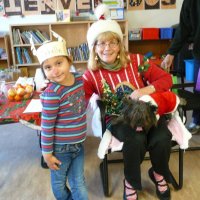 12/16/11 - Annual Christmas with Santa - Mission Education Center, San Francisco - Ms. Linda as Santa, with her dog Emma - Each student takes turns posing with Santa.